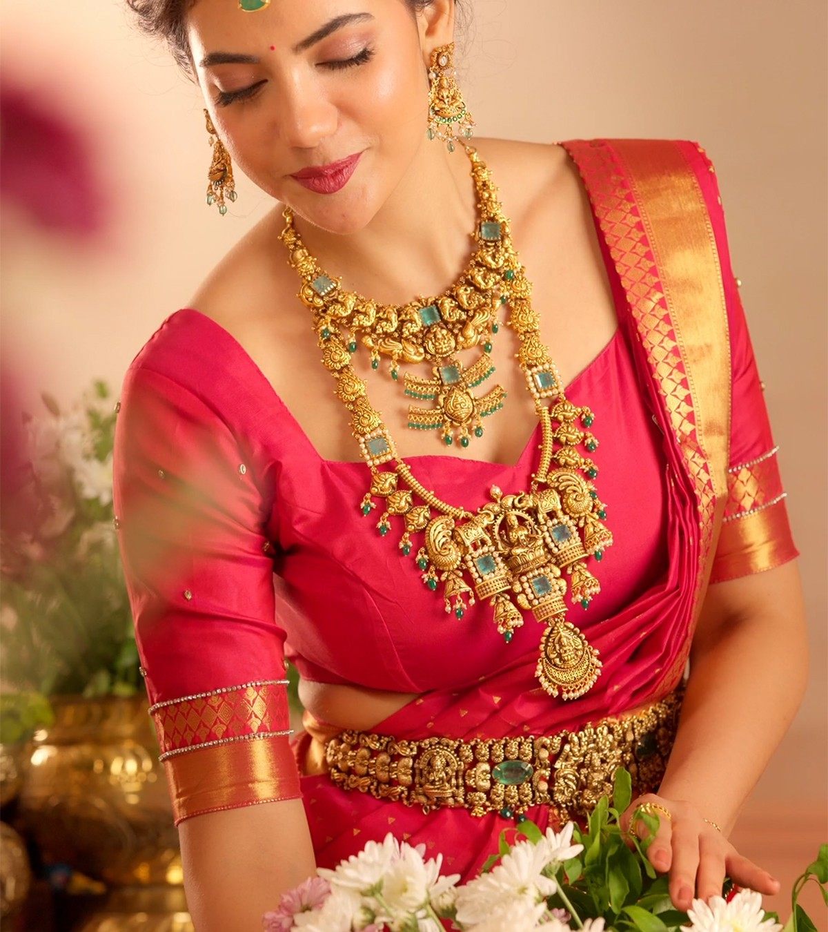 Bride wearing a temple haram, necklace and oddiyanam in gold-plated 925 silver - Vilva Jewels Madurai